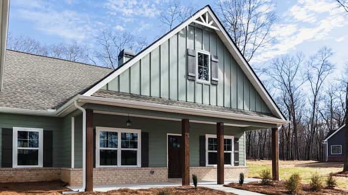 Exterior home renovation with updated roof and siding